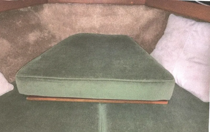 Slide: The Image of Interior cabin of 1983 Egg Harbor 33 Convertible with green cushions. - 15