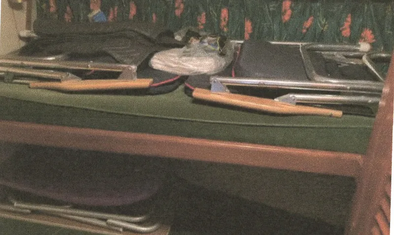 Slide: The Image of Interior of 1983 Egg Harbor 33 Convertible with folded chairs and floral upholstery. - 18