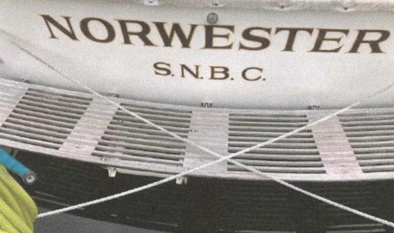 Slide: The Image of 1983 Egg Harbor 33 Convertible boat with "Norwester S.N.B.C." on the stern. - 21