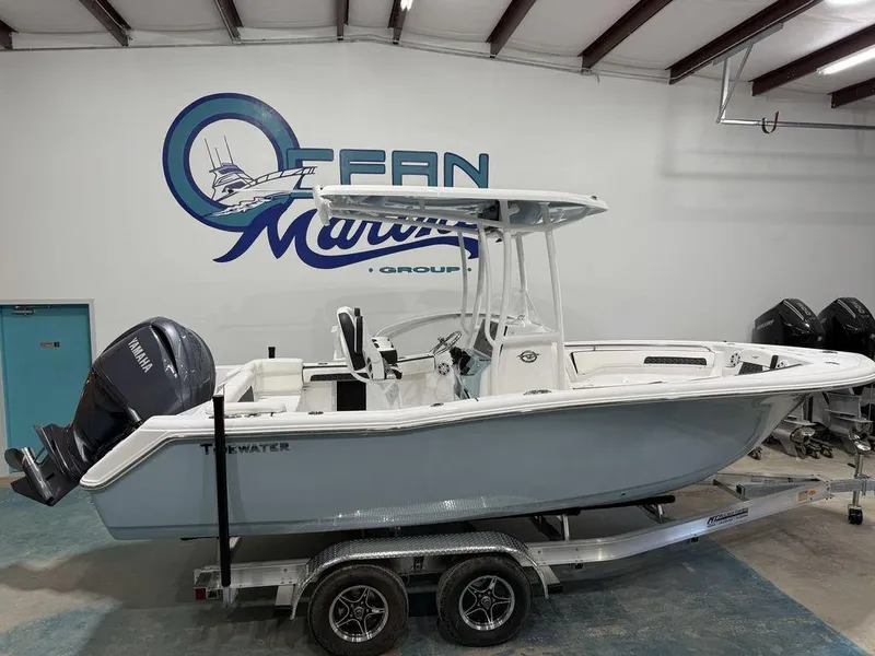 Slide: The Image of 2025 Tidewater 220 LXF boat on trailer in showroom. - 1