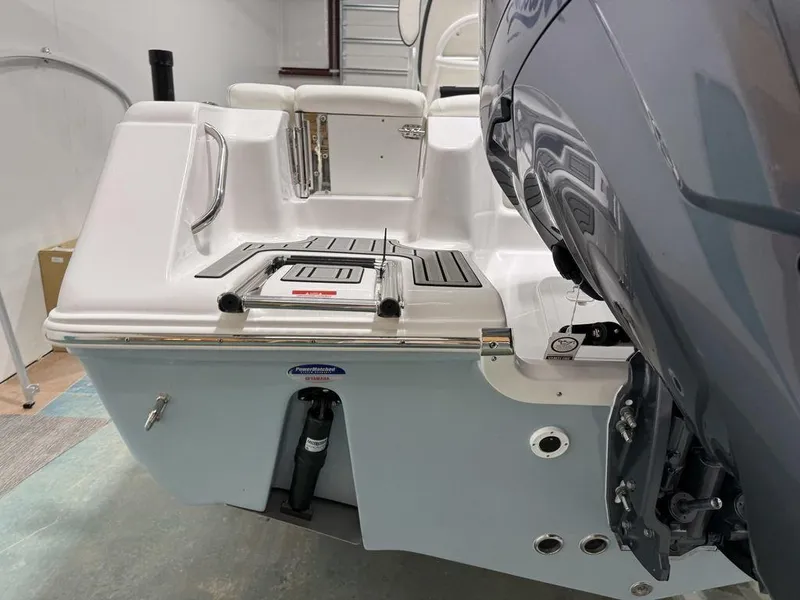 Slide: The Image of 2025 Tidewater 220 LXF boat stern with motor and swim platform. - 11