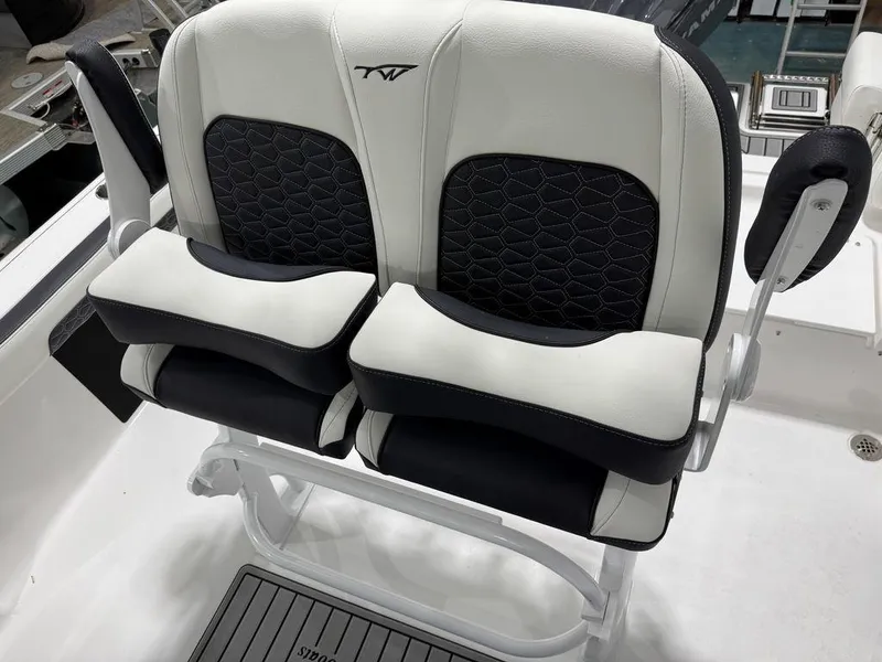 Slide: The Image of 2025 Tidewater 220 LXF boat seats, black and white upholstery, modern design. - 15