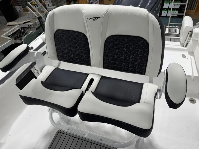 Slide: The Image of 2025 Tidewater 220 LXF boat seats with black and white upholstery. - 17