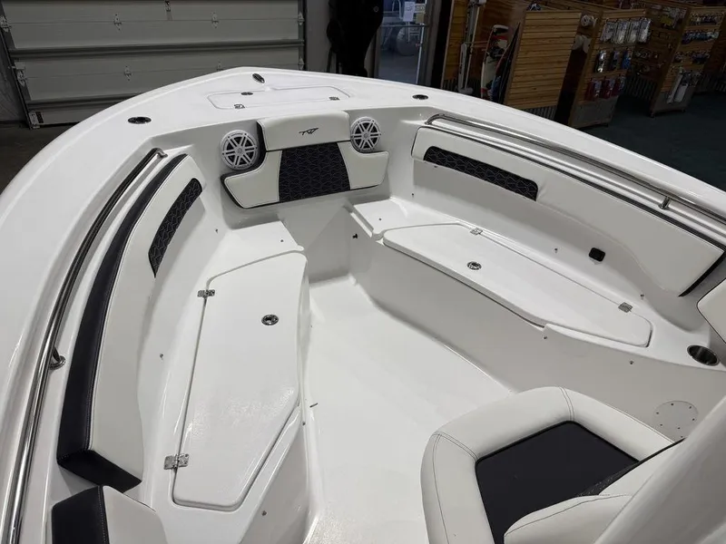 Slide: The Image of 2025 Tidewater 220 LXF boat interior with seating and speakers. - 21