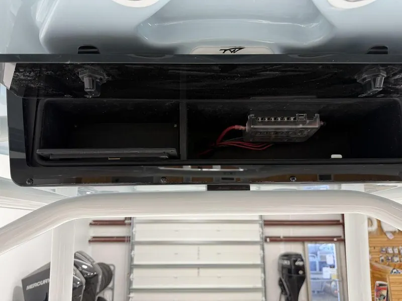 Slide: The Image of Open storage compartment in 2025 Tidewater 220 LXF boat, showing wiring and space. - 22