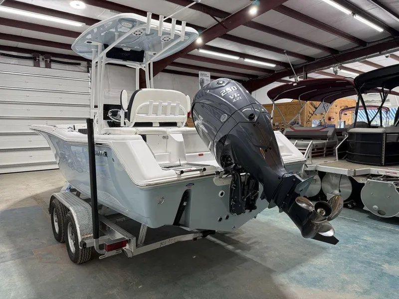 Slide: The Image of 2025 Tidewater 220 LXF boat on trailer in indoor showroom. - 4
