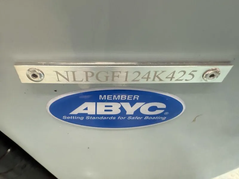 Slide: The Image of Tidewater 220 LXF 2025 boat with ABYC member plaque and serial number. - 41