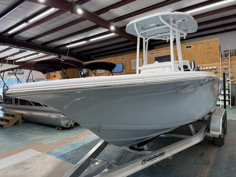 Slide: The Image of 2025 Tidewater 220 LXF boat on trailer in showroom. - 42