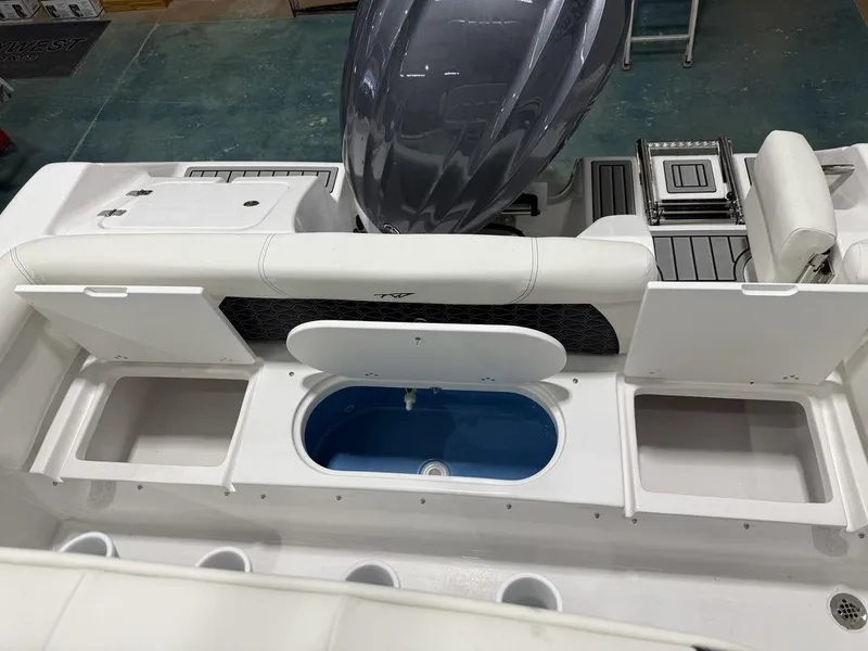 Slide: The Image of 2025 Tidewater 220 LXF boat interior with storage compartments and seating. - 8