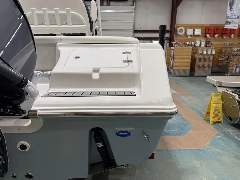 Slide: The Image of 2025 Tidewater 220 LXF boat in showroom, featuring sleek design and modern amenities. - 9