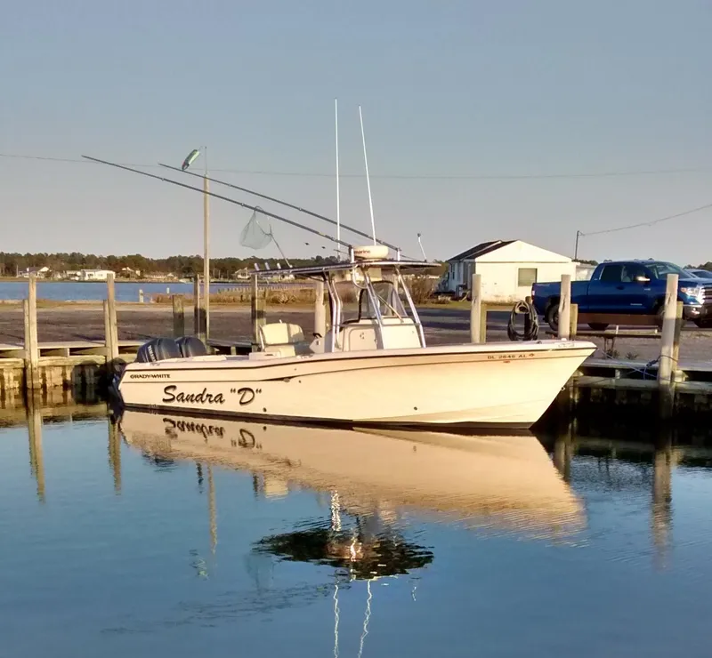 The Image of 2005 Grady-White Release 283 boat docked in calm waters. - 0