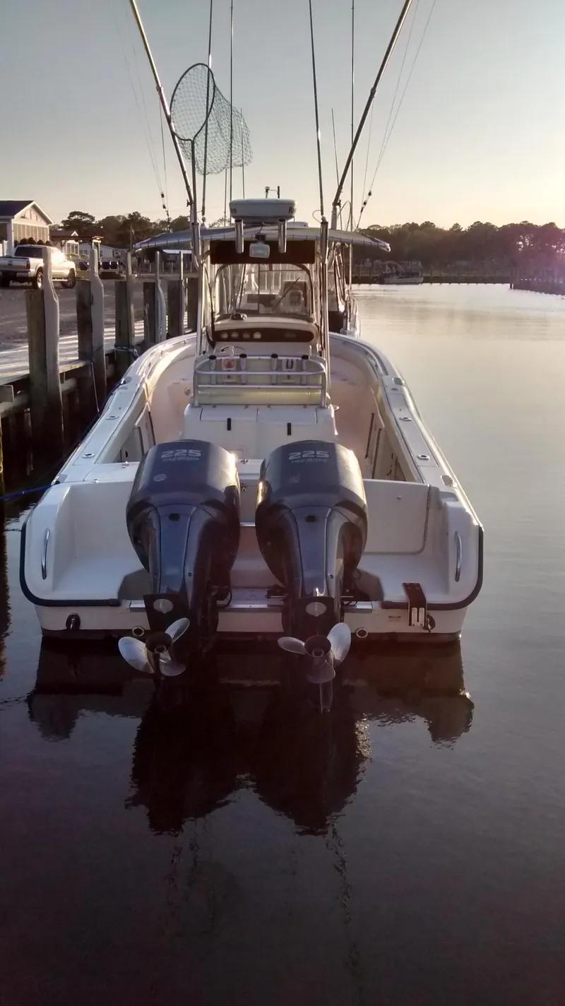 Slide: The Image of 2005 Grady-White Release 283 boat docked with dual engines at sunset. - 3
