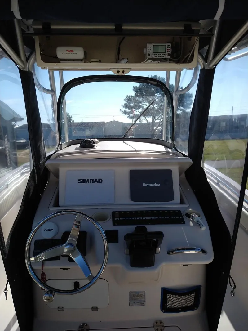Slide: The Image of 2005 Grady-White Release 283 boat cockpit with Simrad navigation system. - 5