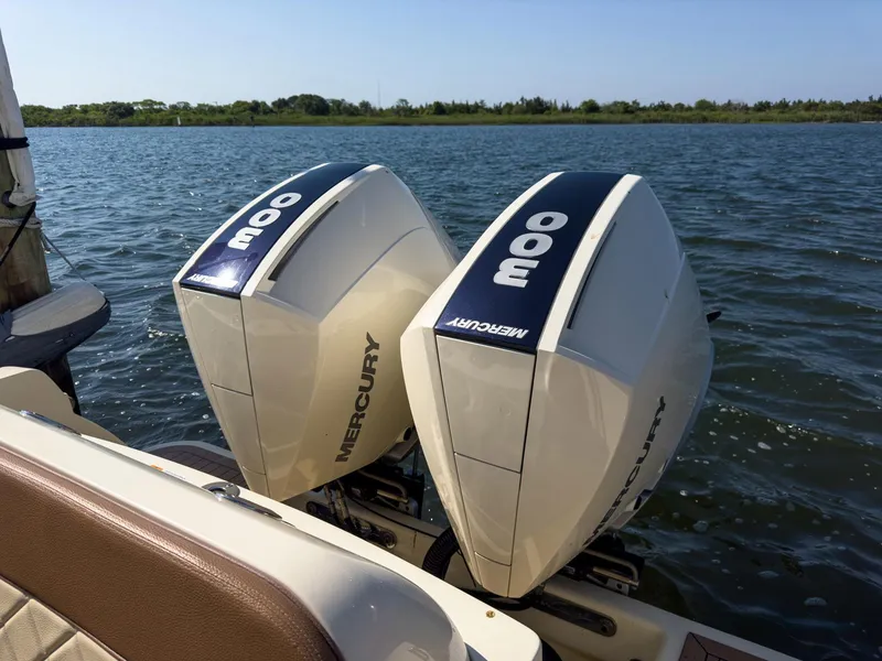 Slide: The Image of 2019 Chris-Craft 30 Catalina with twin Mercury 300 engines on a calm lake. - 10