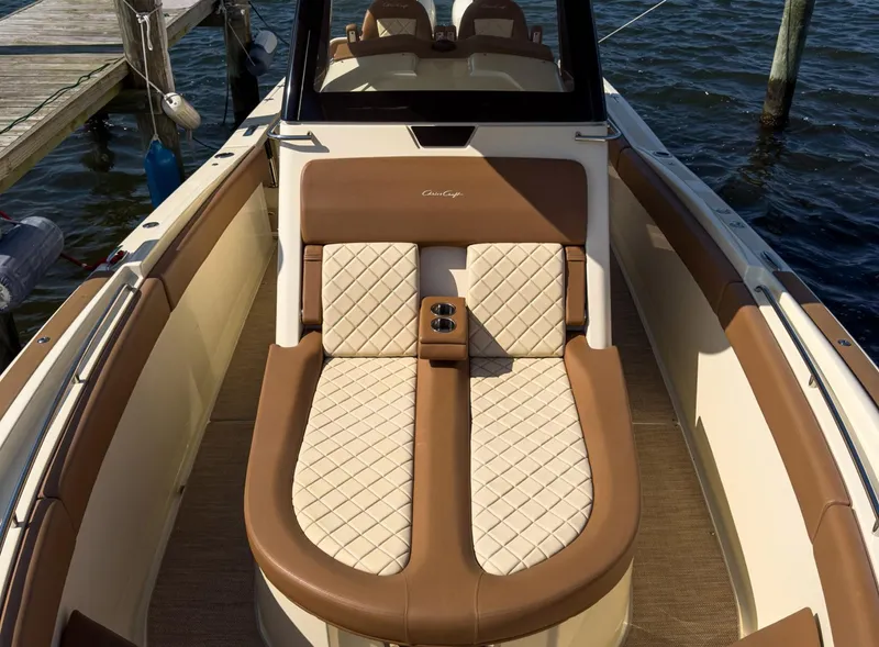 Slide: The Image of Luxurious 2019 Chris-Craft 30 Catalina boat interior with elegant seating and water view. - 12