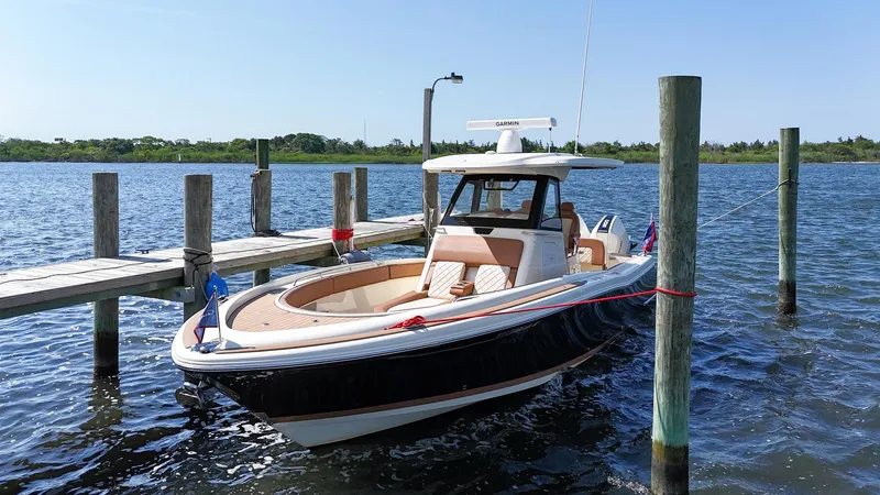 Slide: The Image of 2019 Chris-Craft 30 Catalina docked on a sunny day. - 2