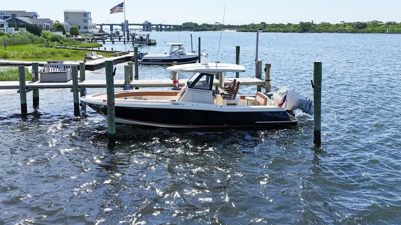 Slide: The Image of 2019 Chris-Craft 30 Catalina docked on a sunny waterfront. - 4