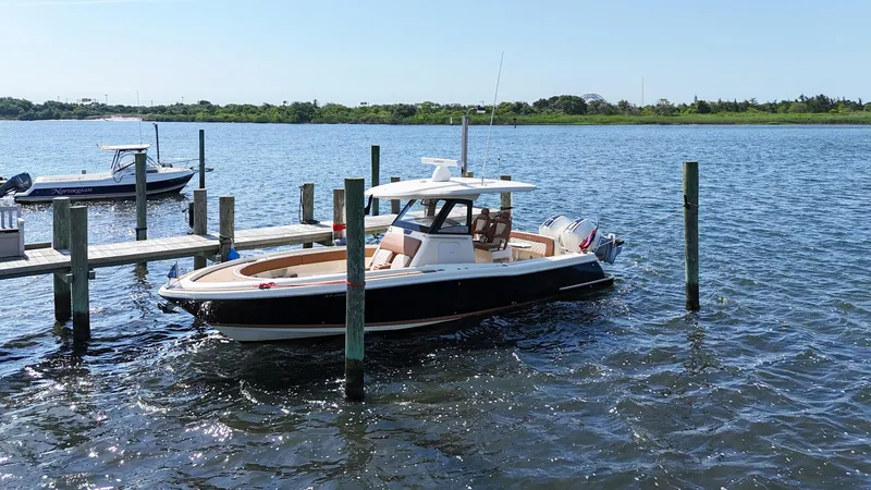 Slide: The Image of 2019 Chris-Craft 30 Catalina boat docked on a sunny day. - 5