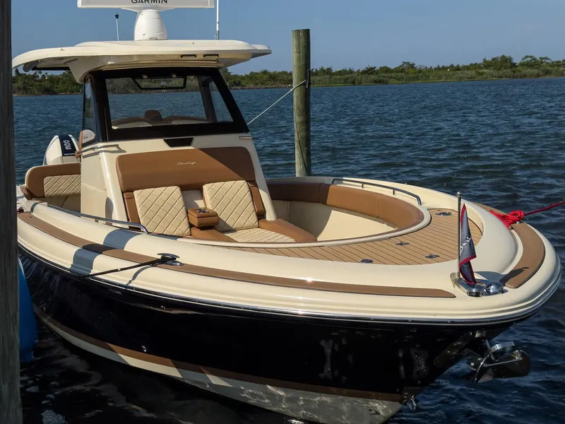 Slide: The Image of 2019 Chris-Craft 30 Catalina boat docked on calm water. - 6