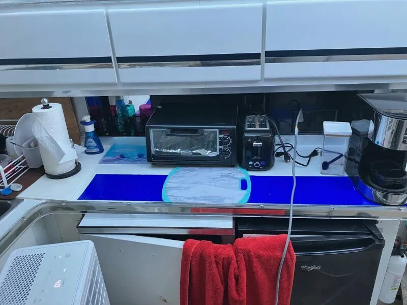 Slide: The Image of Kitchen area in 1988 Wellcraft San Remo 43 yacht with appliances and countertop. - 11