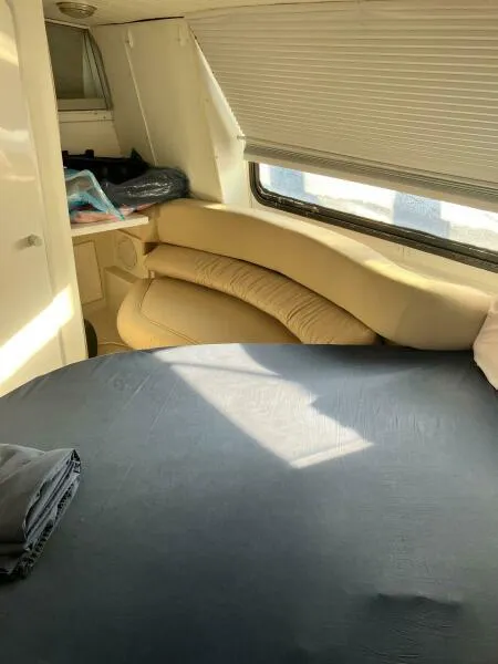 Slide: The Image of Interior of 1988 Wellcraft San Remo 43 yacht with cozy seating and bed. - 14