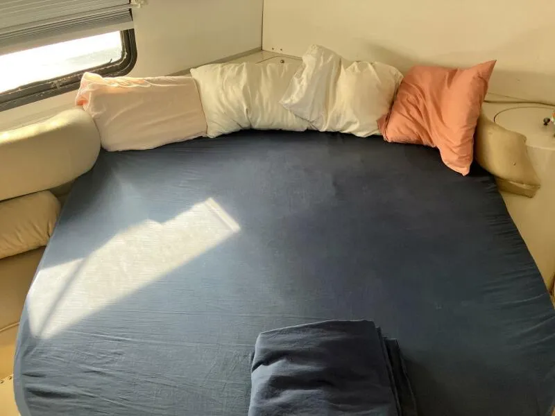 Slide: The Image of Interior cabin of 1988 Wellcraft San Remo 43 with cozy bed and pillows. - 15