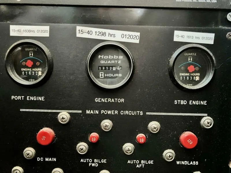Slide: The Image of Control panel of a 1988 Wellcraft San Remo 43 boat, showing engine and generator hours. - 19