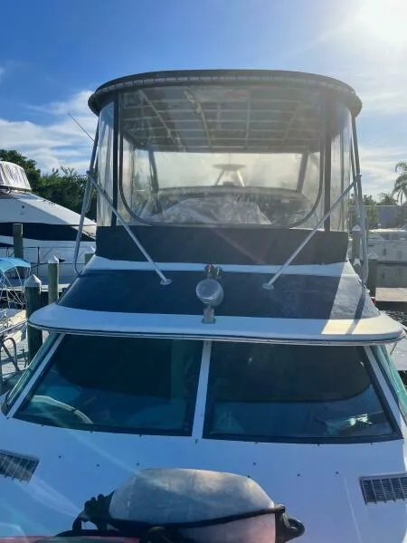 Slide: The Image of 1988 Wellcraft San Remo 43 boat docked under clear blue sky. - 2