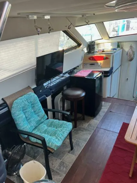Slide: The Image of Interior of 1988 Wellcraft San Remo 43 yacht with seating, TV, and kitchenette. - 6