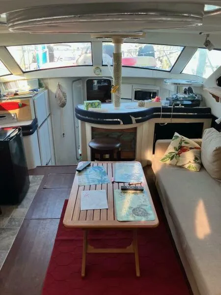 Slide: The Image of Interior of 1988 Wellcraft San Remo 43 yacht with cozy seating and kitchenette. - 7