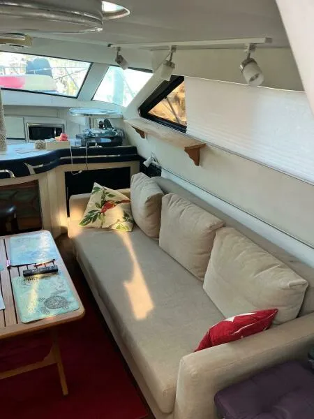 Slide: The Image of Interior of 1988 Wellcraft San Remo 43 yacht with cozy seating and modern decor. - 8