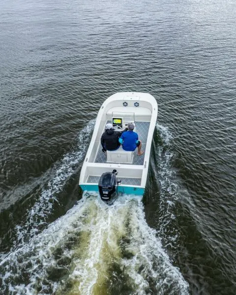 Slide: The Image of 2024 BlueCat 17 LF boat cruising on open water, rear view. - 3