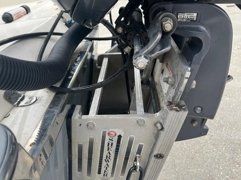 Slide: The Image of ShearWater 23LTZ 2012 boat engine mount detail with visible components. - 17