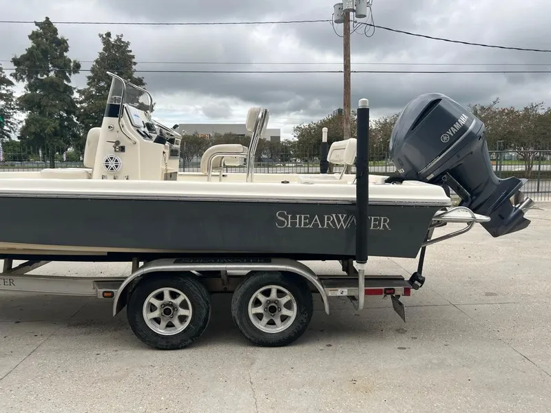 Slide: The Image of 2012 ShearWater 23LTZ boat on trailer with Yamaha outboard motor. - 5