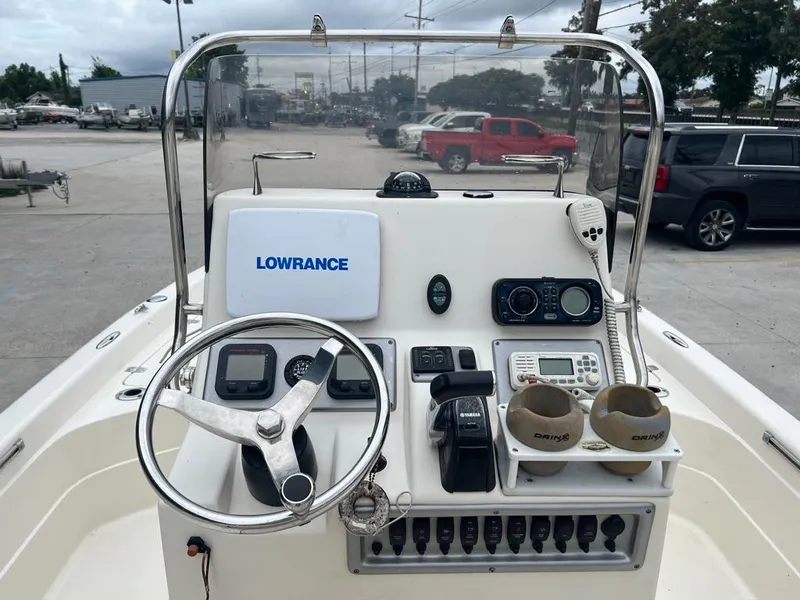 Slide: The Image of 2012 ShearWater 23LTZ boat console with Lowrance navigation system and steering wheel. - 6