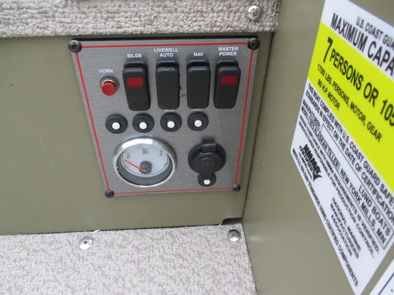 Slide: The Image of Control panel of 2025 Lund Alaskan 1675 Tiller boat with capacity label. - 10