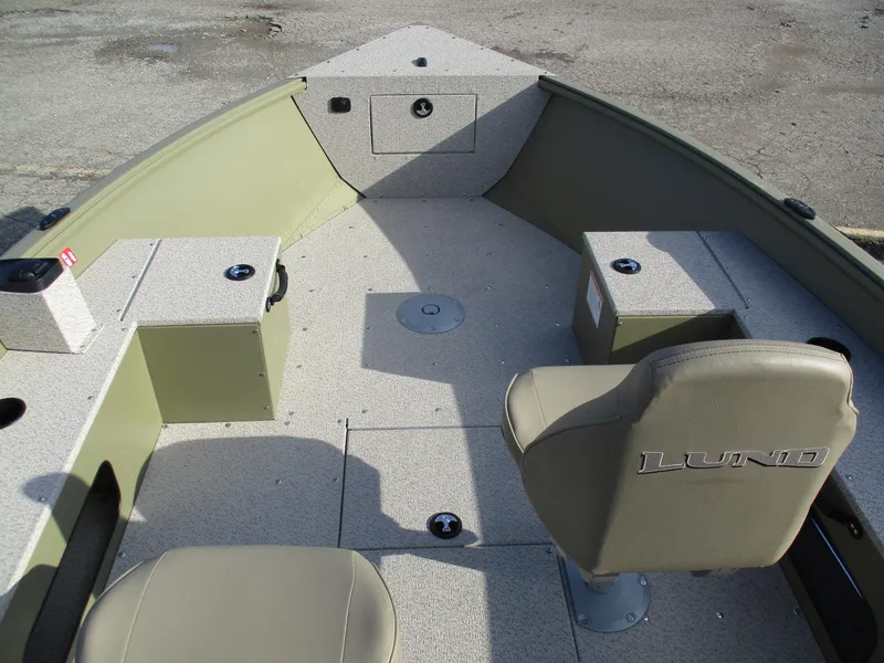 Slide: The Image of 2025 Lund Alaskan 1675 Tiller boat interior with seating and storage compartments. - 6