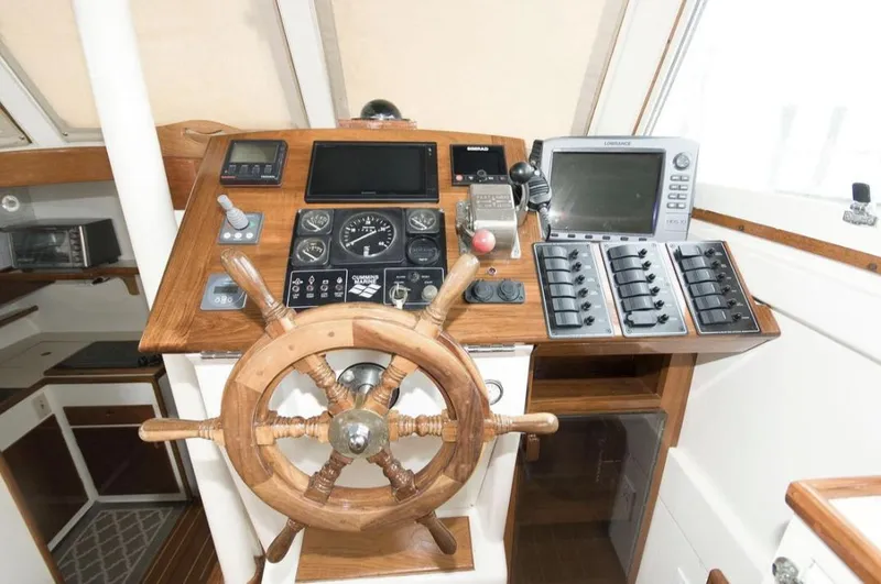 Slide: The Image of Wooden ship helm with navigation instruments, Morton & Hersloff 36, 1978 model. - 11