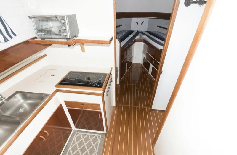 Slide: The Image of 1978 Morton & Hersloff 36 yacht interior with kitchenette and cozy cabin. - 13