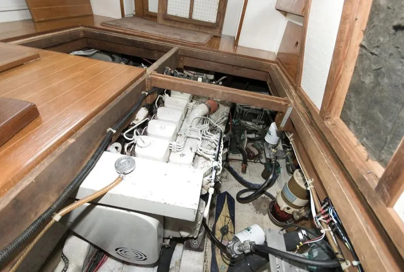 Slide: The Image of Engine room of a 1978 Morton & Hersloff 36 boat, showcasing mechanical components. - 16