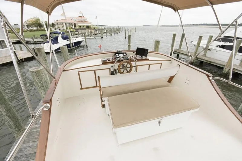 Slide: The Image of 1978 Morton & Hersloff 36 boat interior with helm, docked at marina. - 3