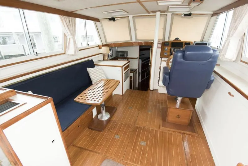 Slide: The Image of 1978 Morton & Hersloff 36 boat interior with seating, table, and helm station. - 7