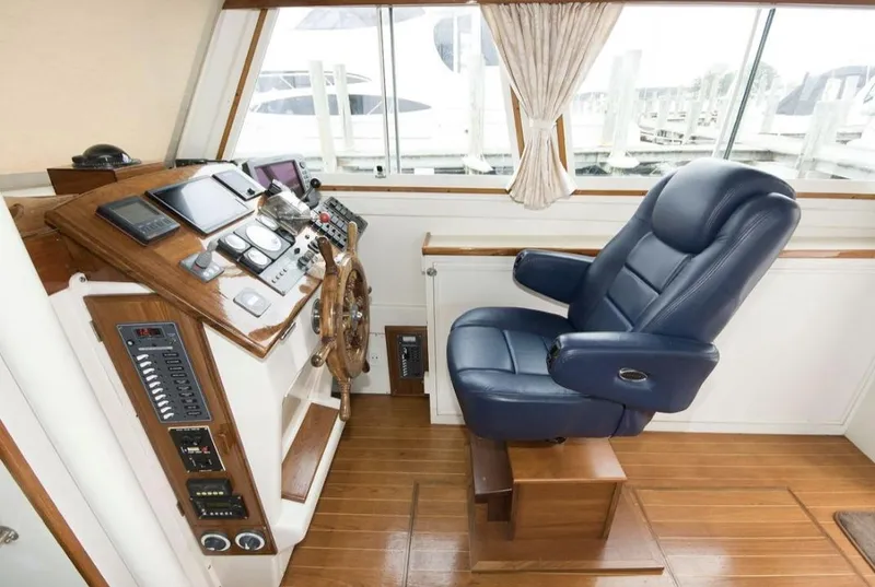 Slide: The Image of Helm of 1978 Morton & Hersloff 36 boat with navigation equipment and captain's chair. - 9