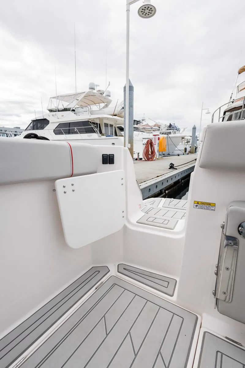 Slide: The Image of 2025 Solara S-250 Coupe boat interior at marina dock. - 15