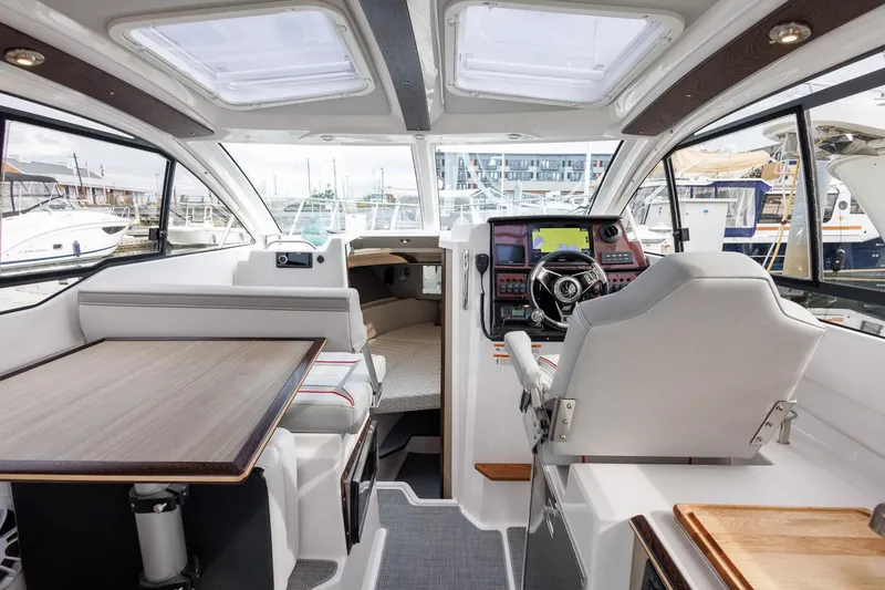 Slide: The Image of Luxurious interior of 2025 Solara S-250 Coupe boat with modern helm and seating. - 26
