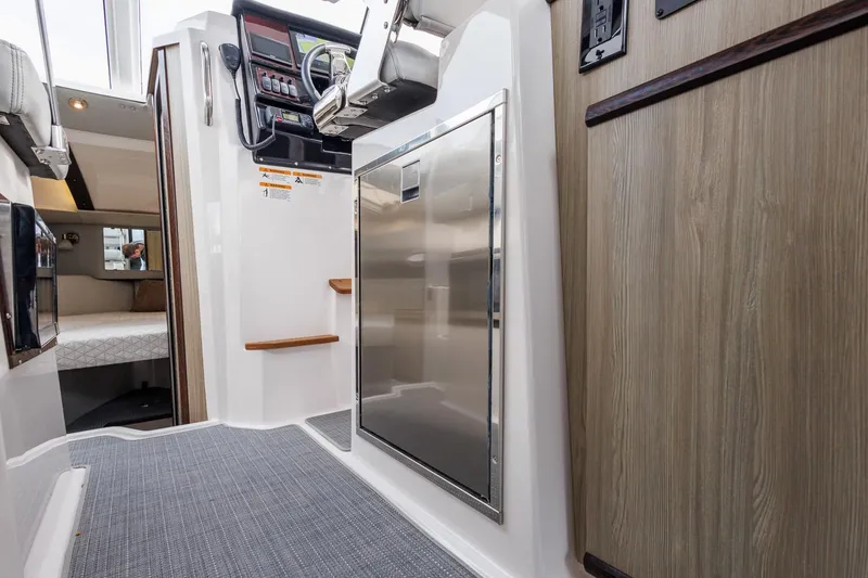 Slide: The Image of Interior of 2025 Solara S-250 Coupe, featuring modern design and wood accents. - 35