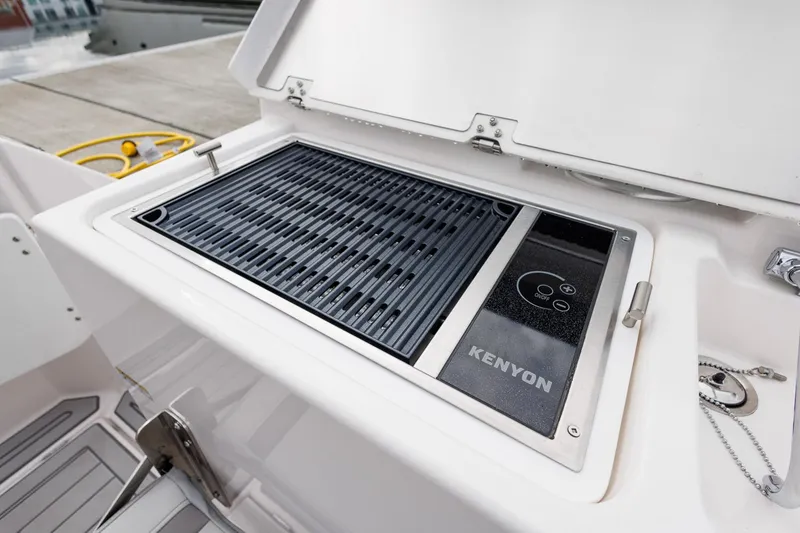 Slide: The Image of Built-in Kenyon grill on 2025 Solara S-250 Coupe boat deck. - 6
