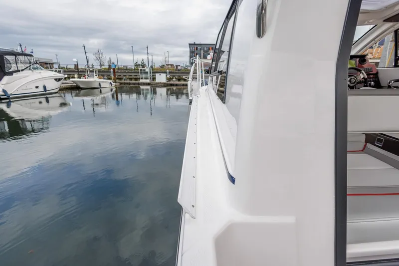 Slide: The Image of 2025 Solara S-250 Coupe docked at marina, side view. - 13