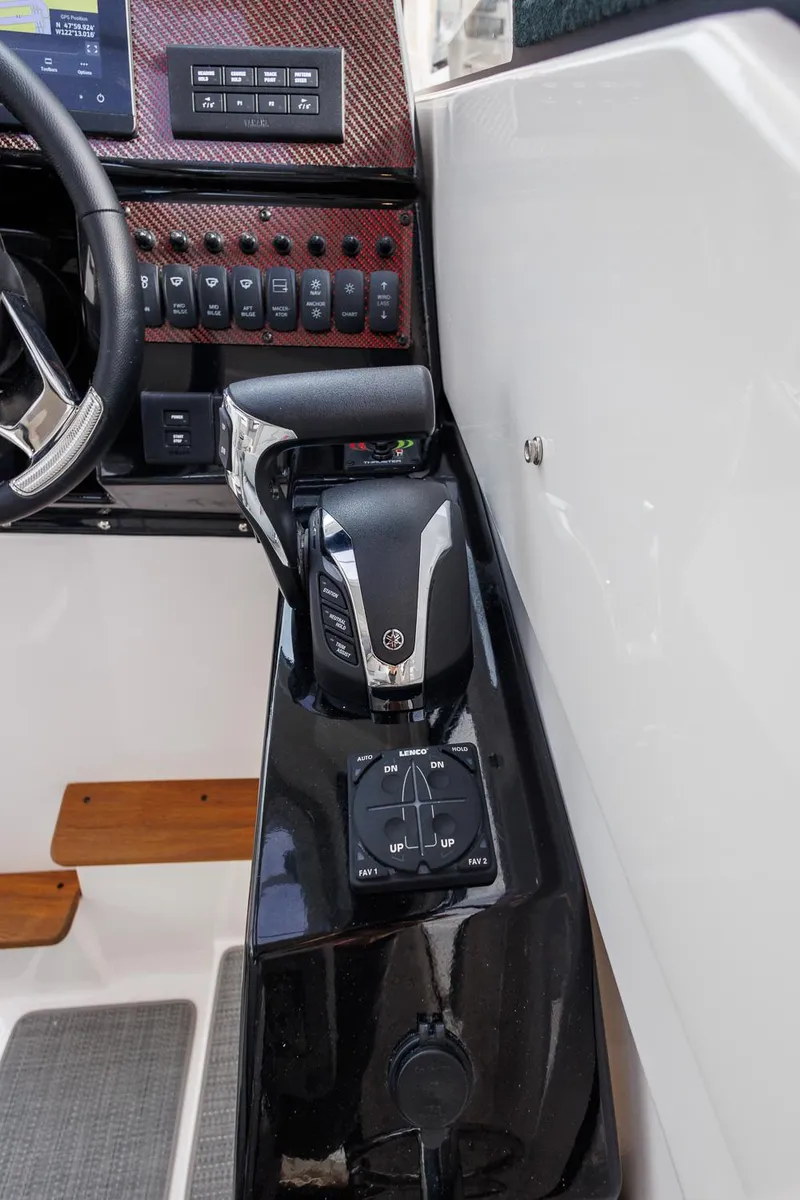 Slide: The Image of 2025 Solara S-250 Coupe interior dashboard with control panel and steering wheel. - 25