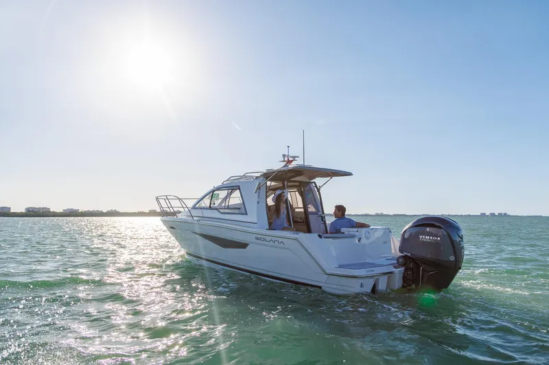 Slide: The Image of 2025 Solara S-250 Coupe boat cruising on sunny ocean waters. - 3